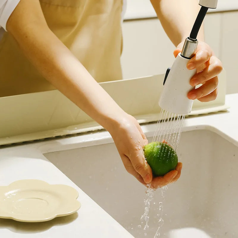 Sink splash guard preventing water from splashing onto kitchen counter