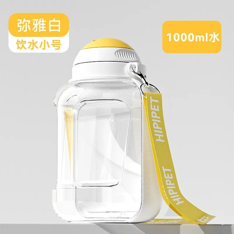 Clear pet water bottle with yellow strap and lid on a gray background