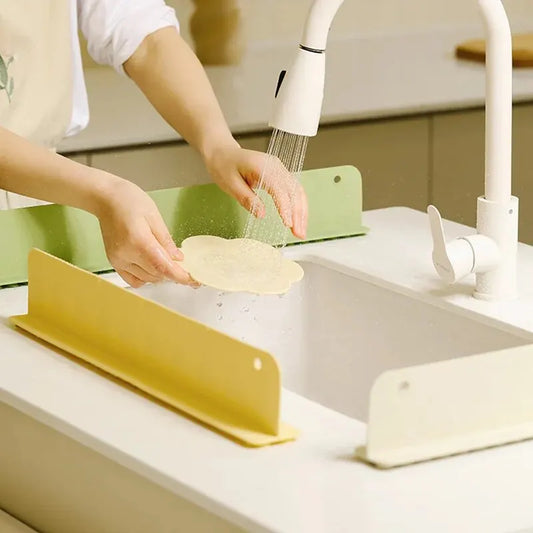 Sink splash guard preventing water from splashing onto kitchen counter
