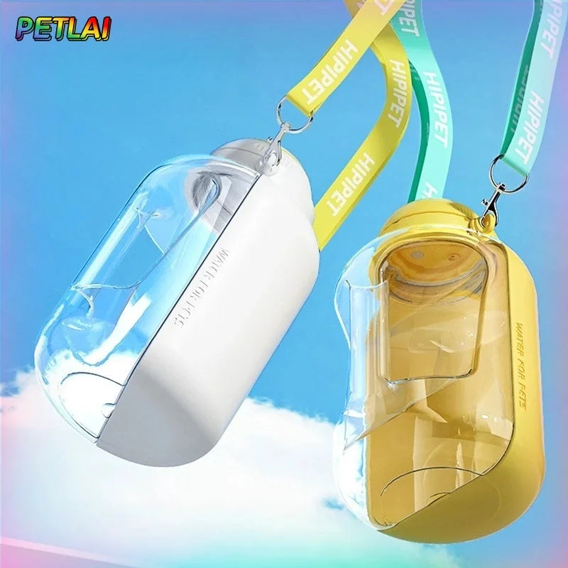Dog drinking from portable water bottle during an outdoor walk"